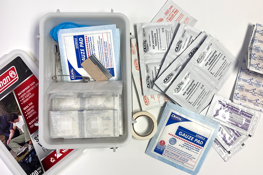 100-piece waterproof first aid kit contains essential first aid supplies including bandages, gauze pads, and antiseptic wipes