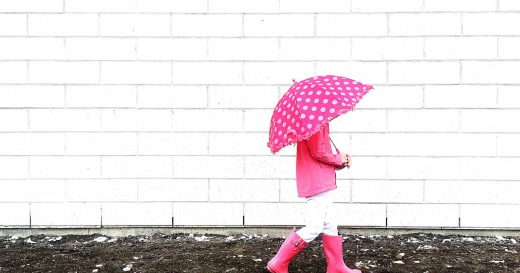 Pink umbrella in rain