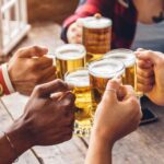 5 people toasting with beer mugs
