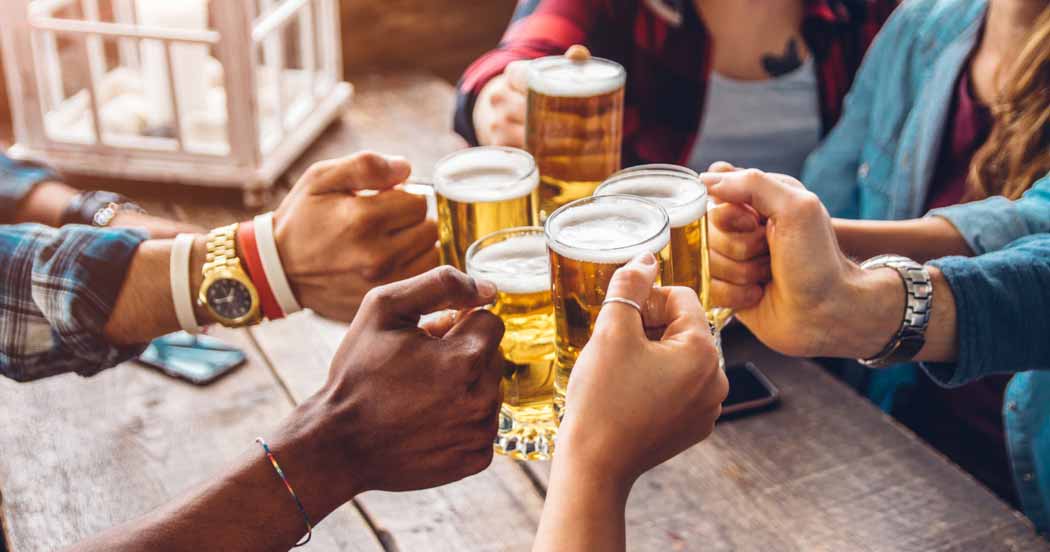 5 people toasting with beer mugs
