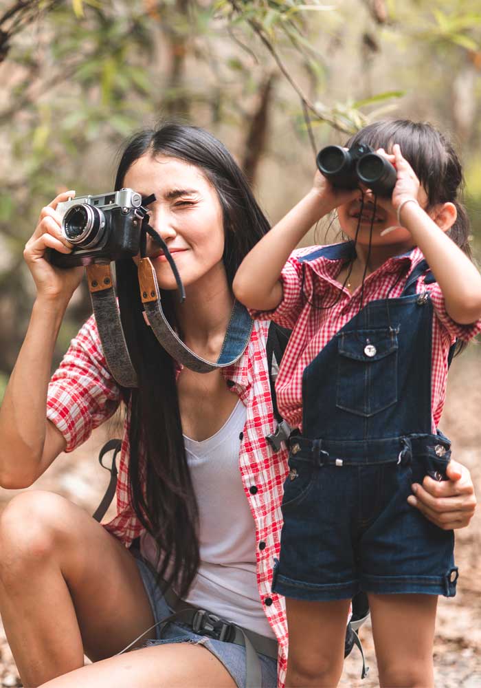 mom and daughter watching birds