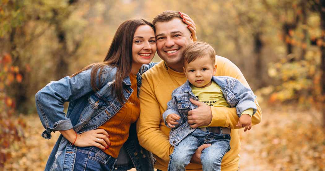 family with little boy in fall