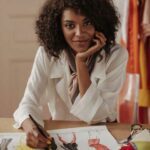 woman fashion designer taking a break from drawing